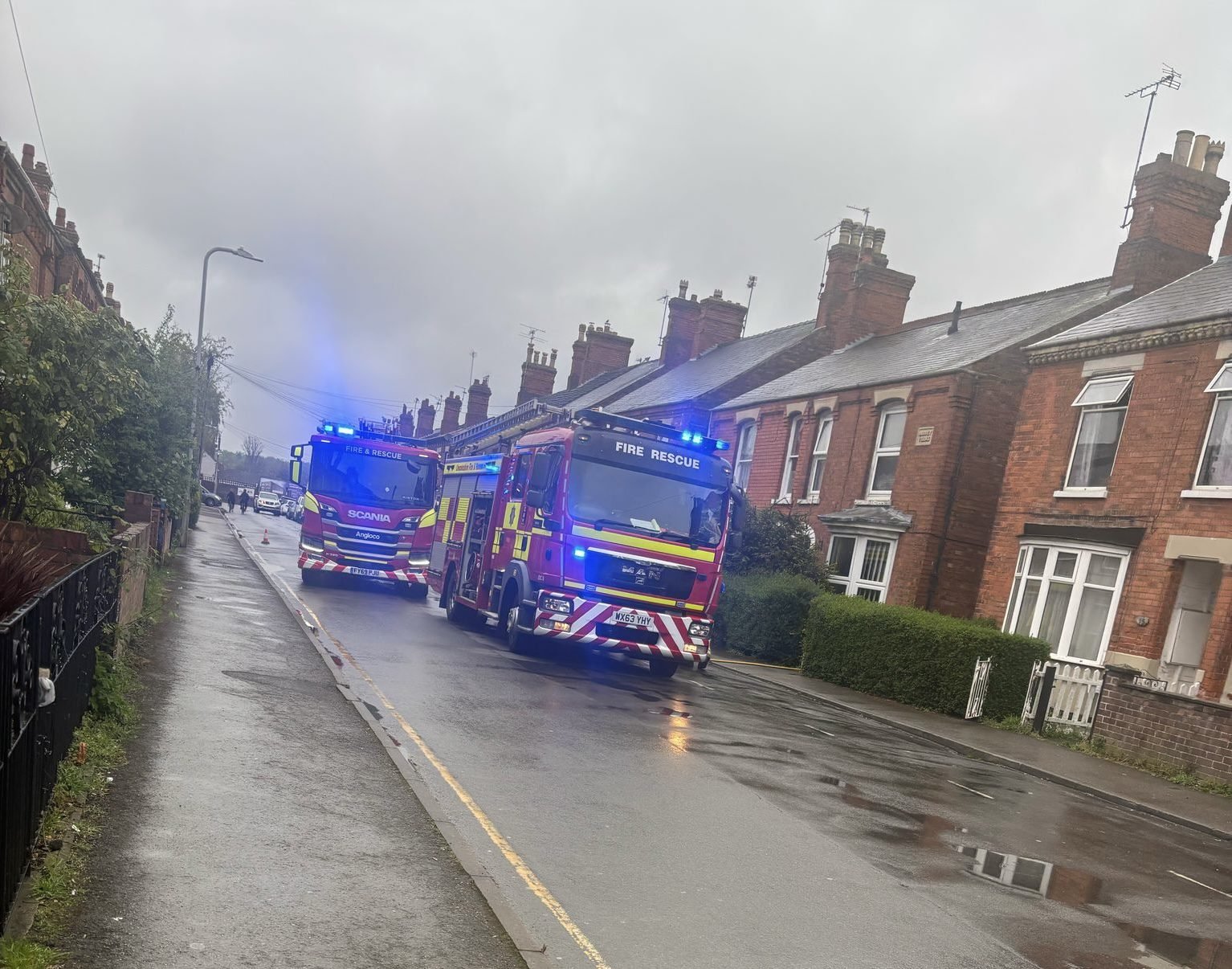 Fire crews close residential street to tackle house fire
