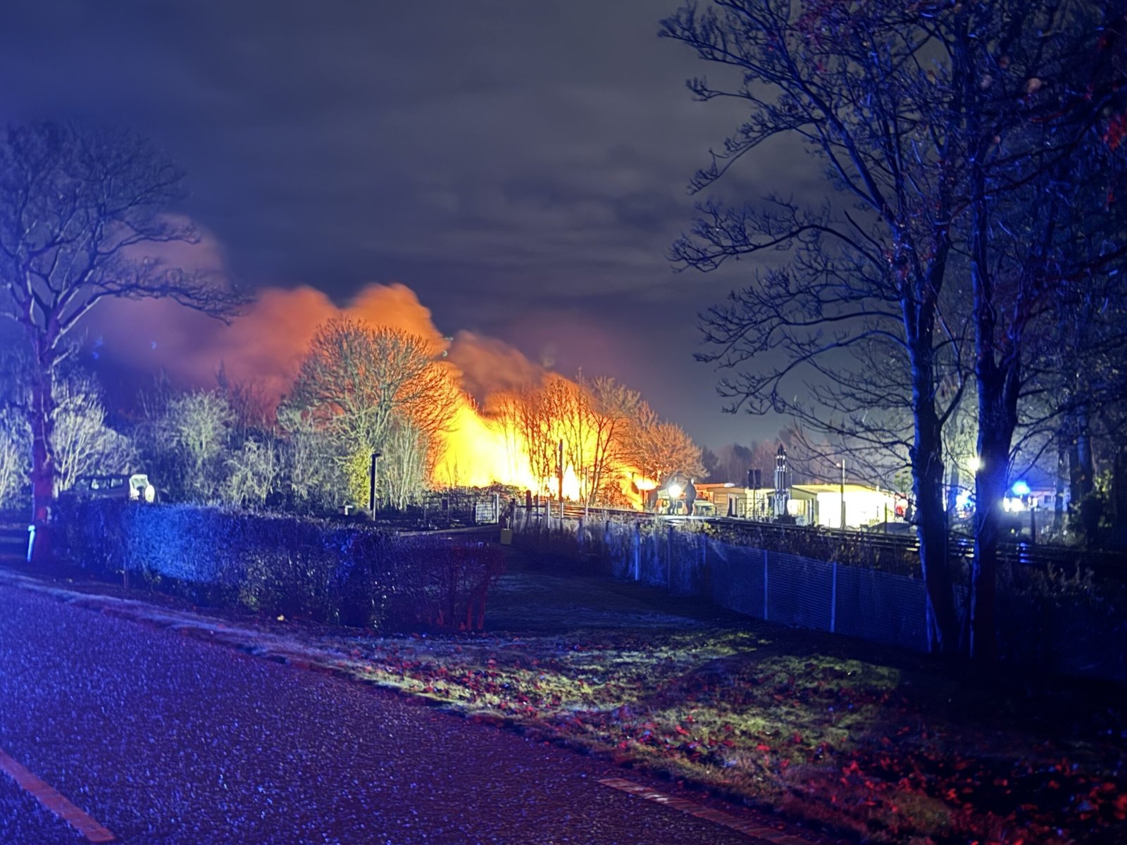 Large property fire sees trains cancelled and roads closed