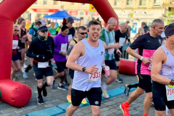 A runner taking part in the half marathon at the start of the run in Boston Market Place A runner taking part in the half marathon at the start of the run in Boston Market Place