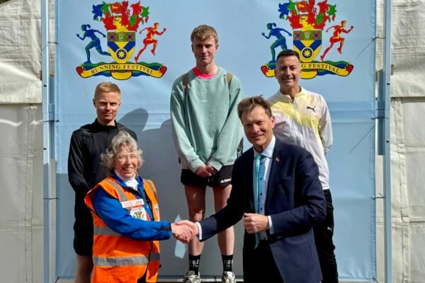 Committee Chair, Sue Durrant shakes hands with Member of Parliament for Boston and Skegness, Richard Tice, as they greet the male top three of the Half Marathon Committee Chair, Sue Durrant shakes hands with Member of Parliament for Boston and Skegness, Richard Tice, as they greet the male top three of the Half Marathon